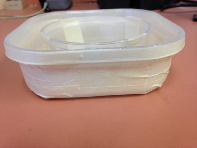 Figure 5. The rough-surfaced tape has been tightly wrapped around the large container. It is important that the tape is wrapped tightly and that there are not any cracks or crevices created where bed bugs can hide.