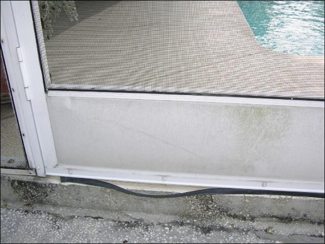 Figure 3. Door sweeps can prevent snakes from inadvertently slipping into the home under a door, but must be checked periodically. This rubber door strip is in disrepair, leaving large gaps beneath the door.
